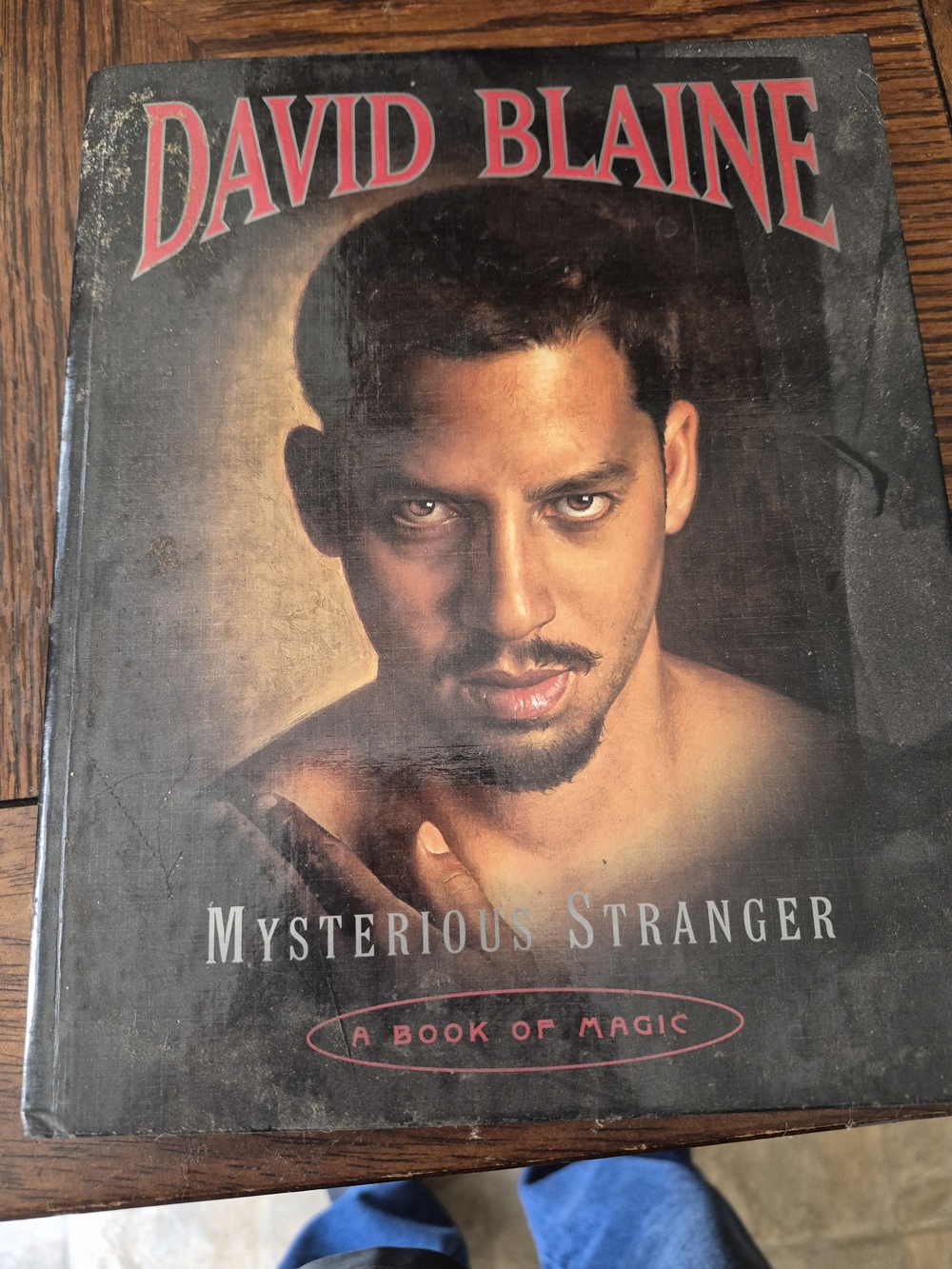 Mysterious Stranger — Hardcover Book in Black and Tan Cover